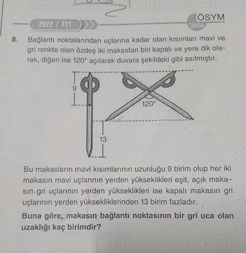 Bağlantı noktalarından uçlarına kadar olan kısımları mavi ve gri renkte olan özdeş iki...